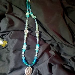 Vintage locket on glass and Vintage glass beads